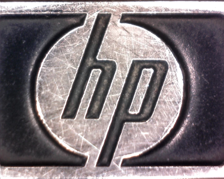 a metal sticker with a hp logo on it