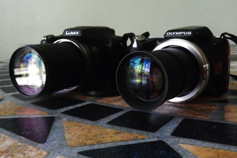 two camera lens with their focus on the image