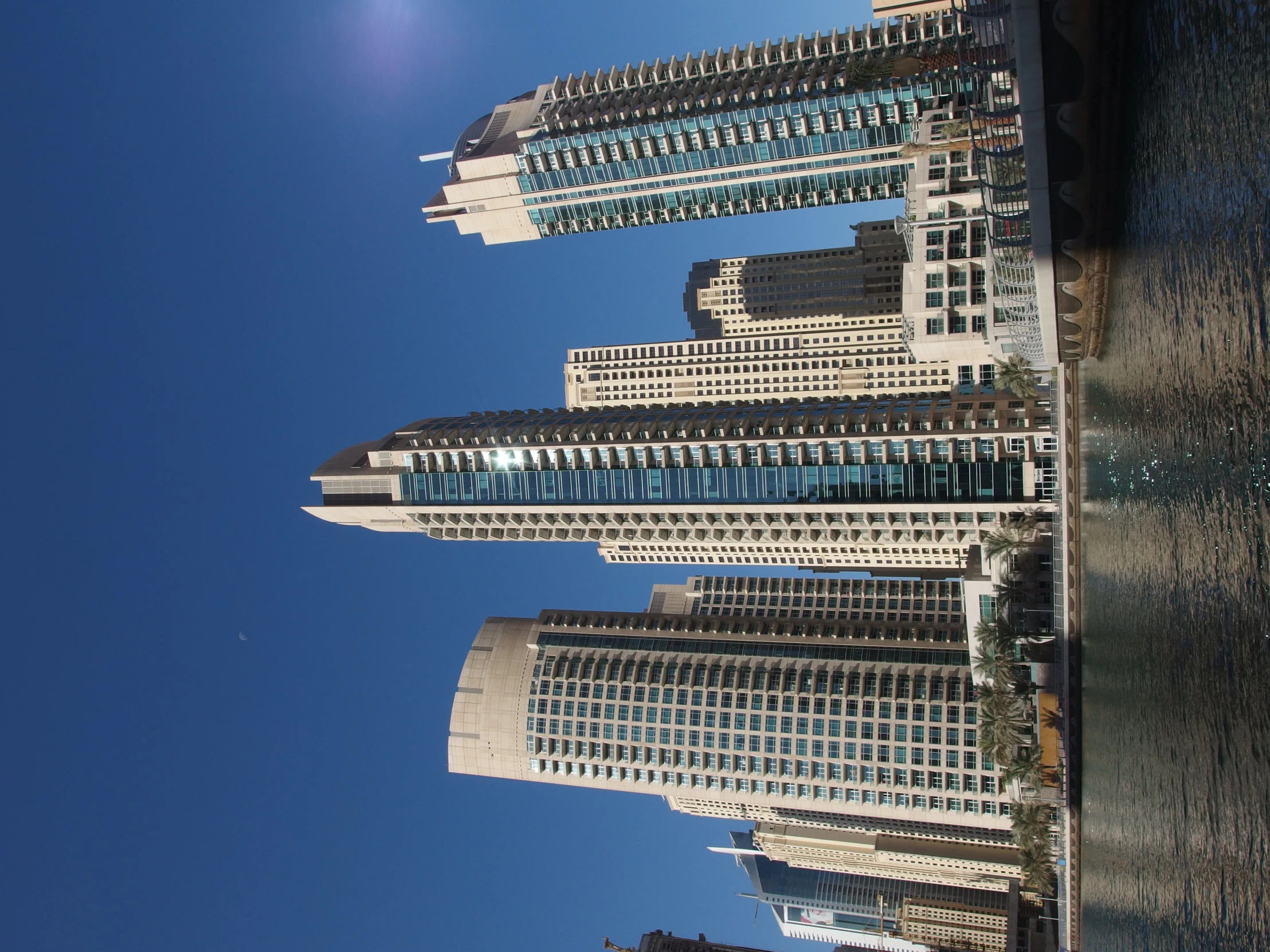 the skyscrs of an urban city seen from the water