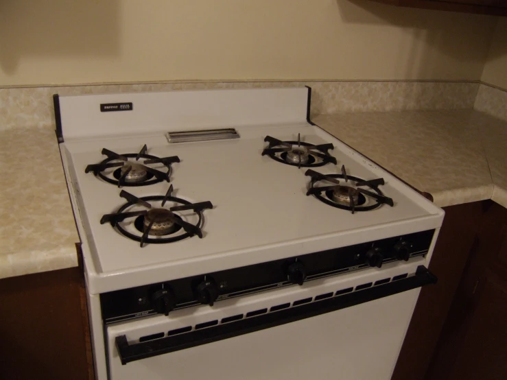 a white oven with two burners sitting on top of it