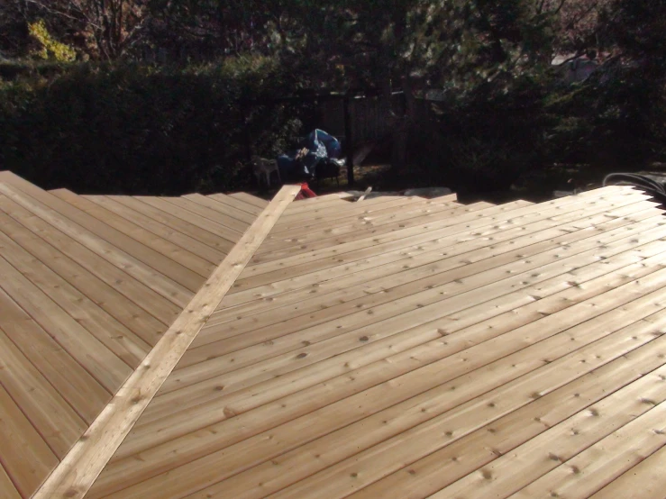 a view of a wooden roof in the daytime