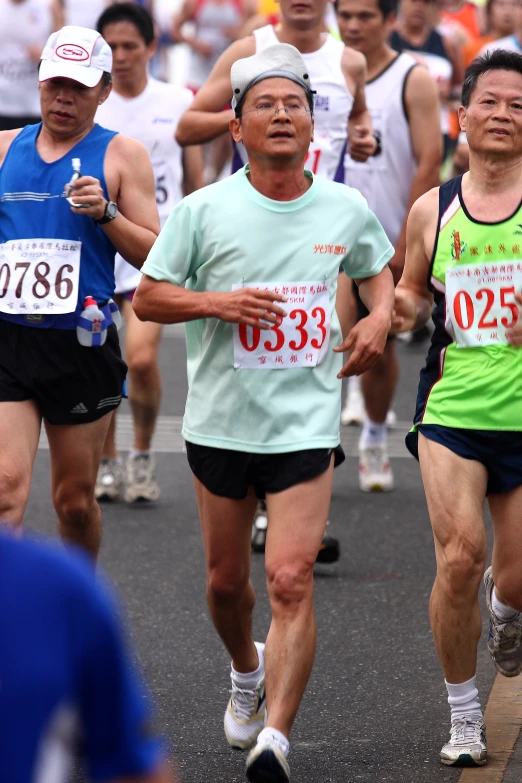 men are running in an organized marathon