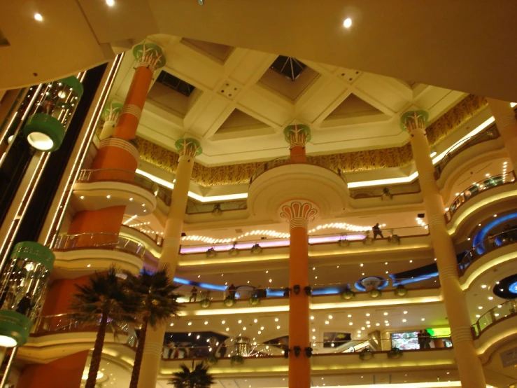 a large lobby with a ceiling that has a sculpture of a bird sitting on top