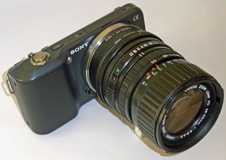 an old camera is shown on a white table