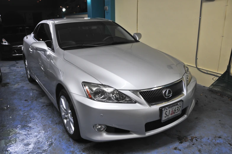 a silver car sitting in a garage