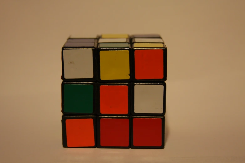 a rubik cube has multicolored squares, on it