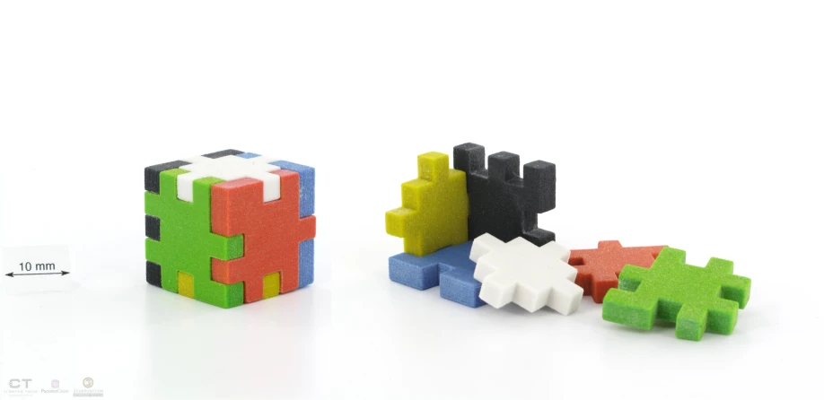 three colorful blocks with one big block next to the other