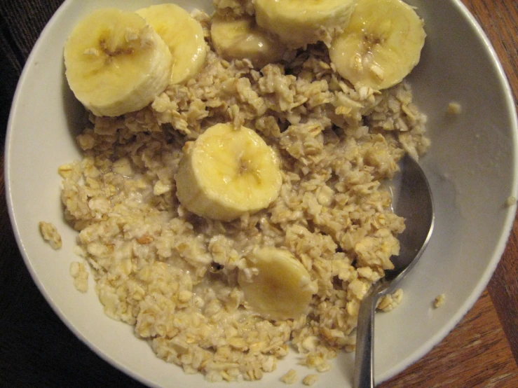 a bowl filled with rice and bananas on top of it