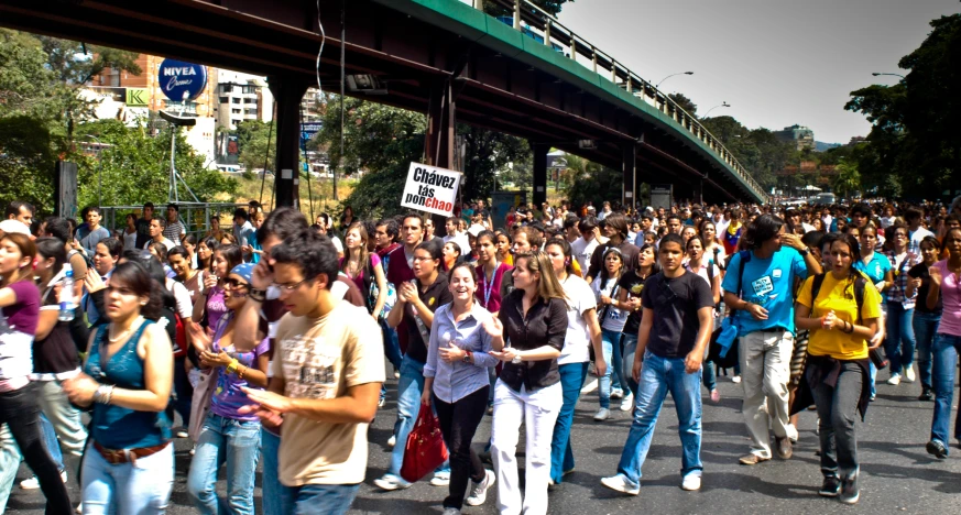 several people are crossing the street on separate sides