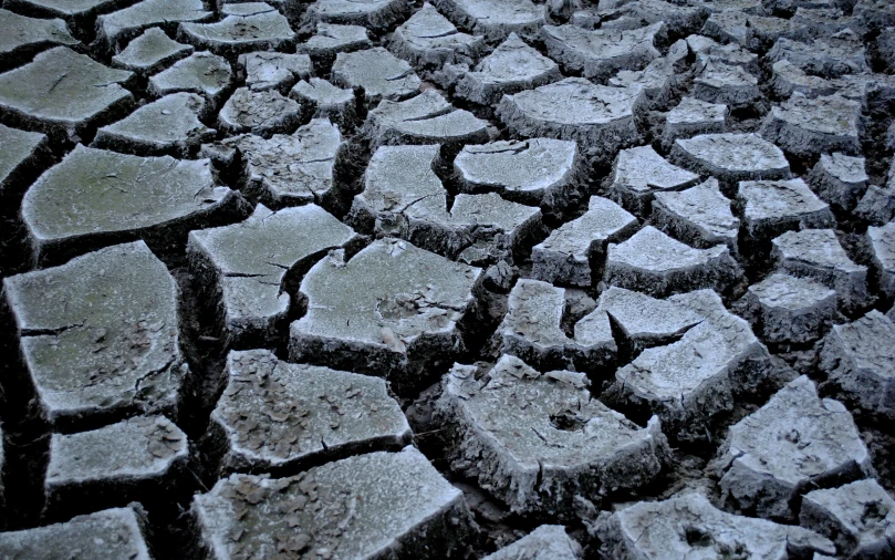 ed concrete from an old brick road with water dles