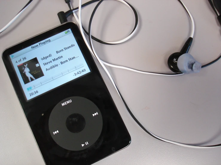 an mp3 player plugged in and ear buds connected to it