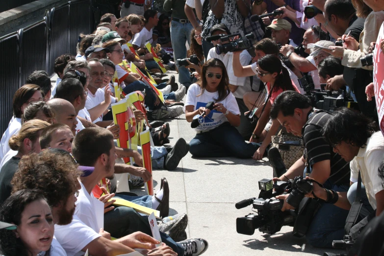 a crowd of people sitting next to each other