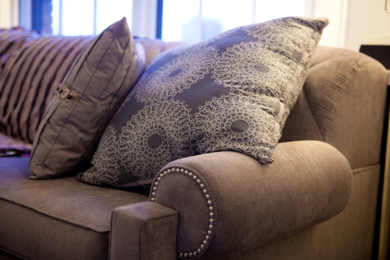 a couch with two pillows sitting on it