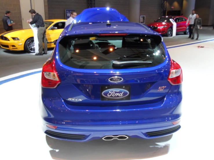 the back end of a blue ford vehicle