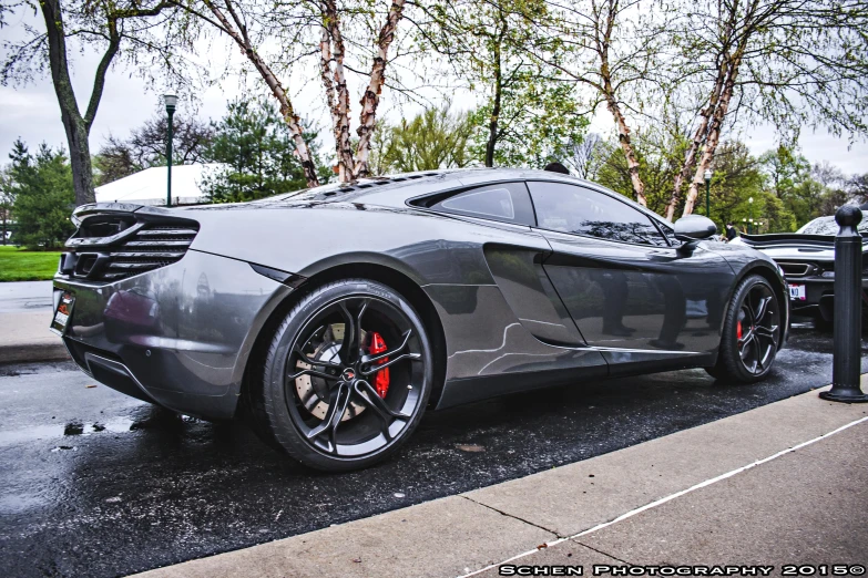 the front end of a large silver sports car