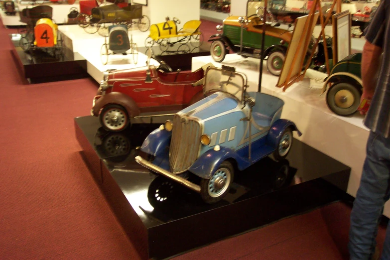 a row of vintage cars sitting on display