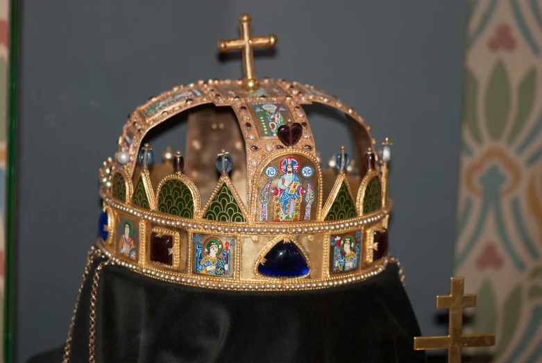 a crown with some decorations and some crosses