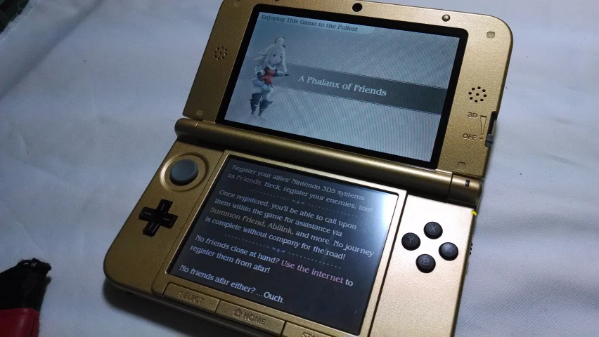 a gameboy is on display with writing on it