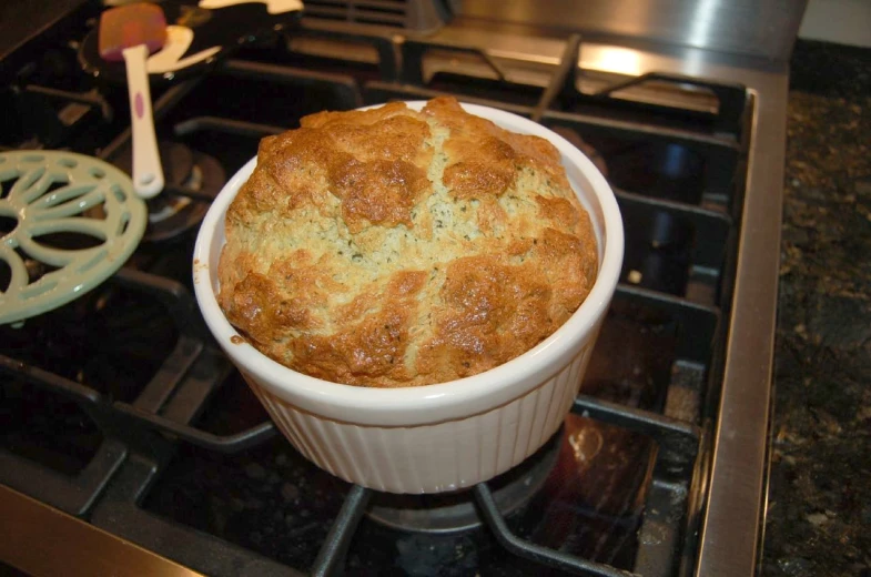 there is a large bowl of baked items on the stove