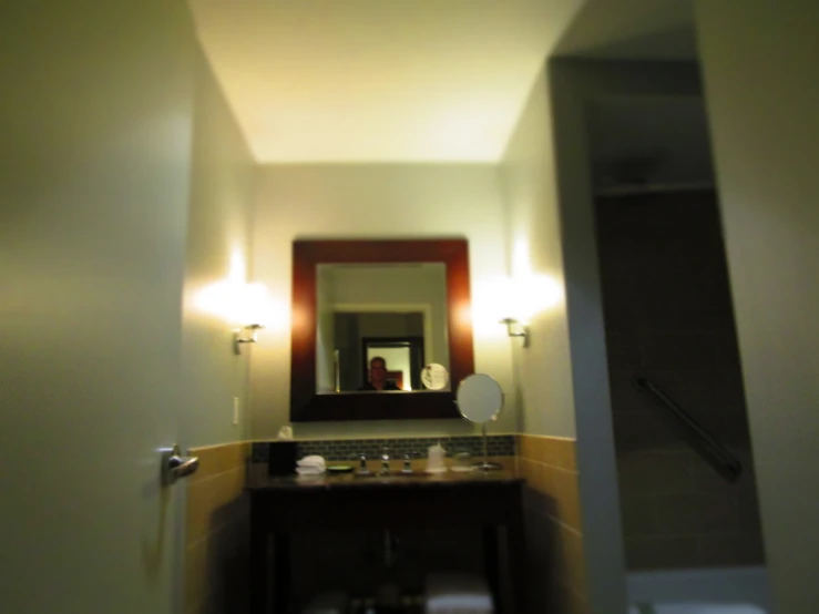 an empty bathroom with a sink and mirror