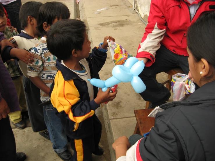 a group of children are standing in a line