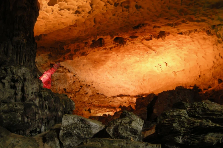 the light shines down on a cave