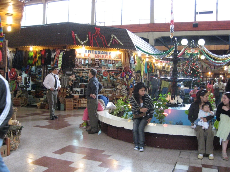 a shop filled with lots of people next to each other