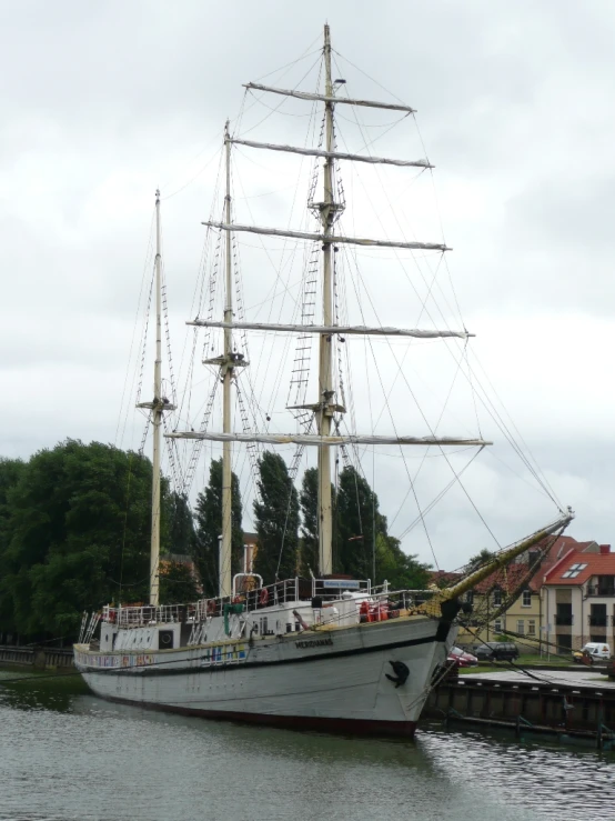 a boat is docked in the water near buildings