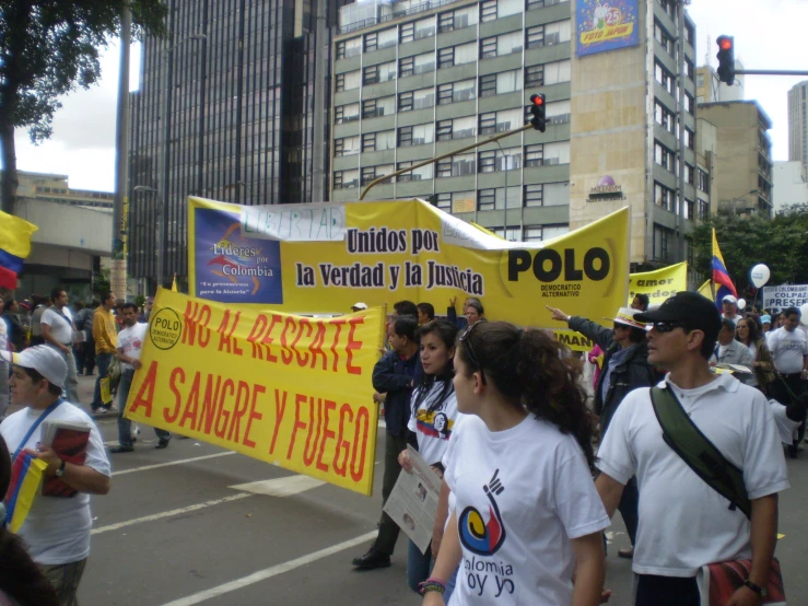 people walking down the street protesting