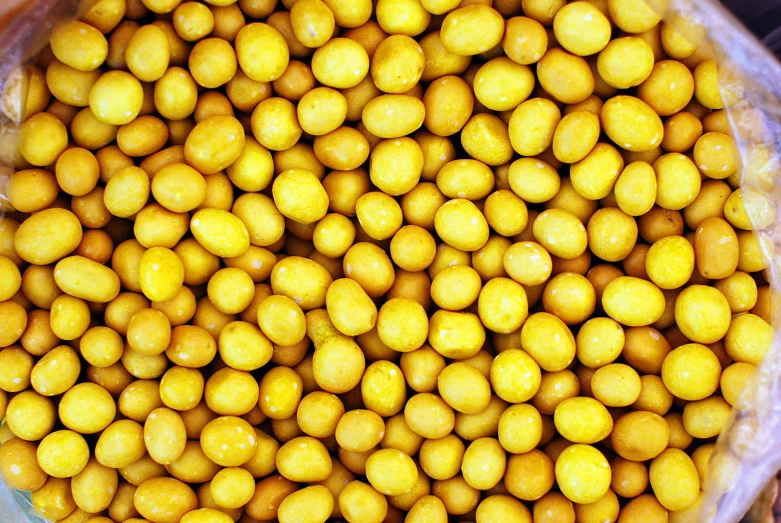 a close up s of yellow fruit in plastic packaging