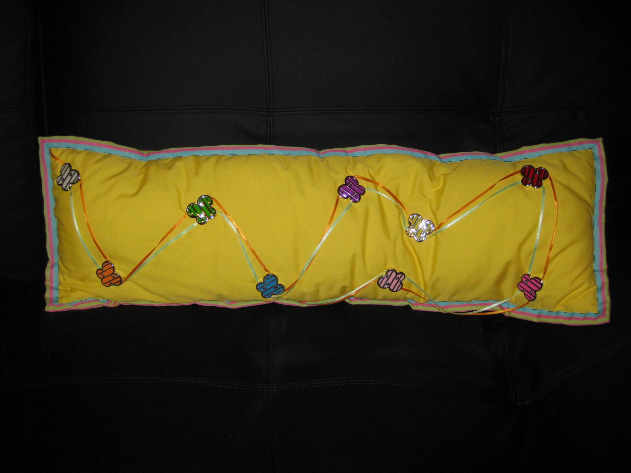 this is a decorative cushion on the back of a couch