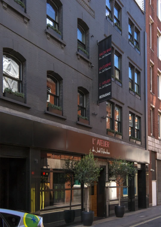 a street scene with focus on the corner shopfront