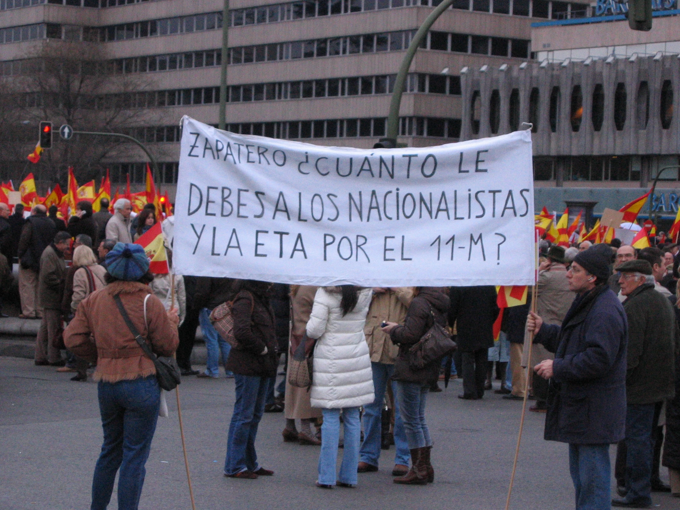 people on the street with protest signs on the street