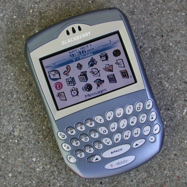 an electronic device sitting on a sidewalk on a pavement