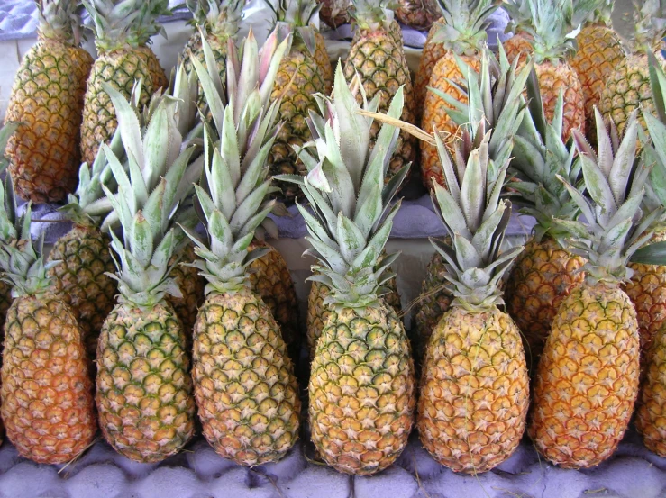 several different types of pineapples on a stand