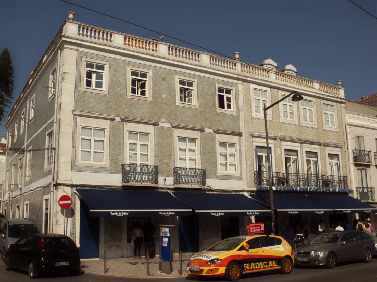 a street view of a building and cars