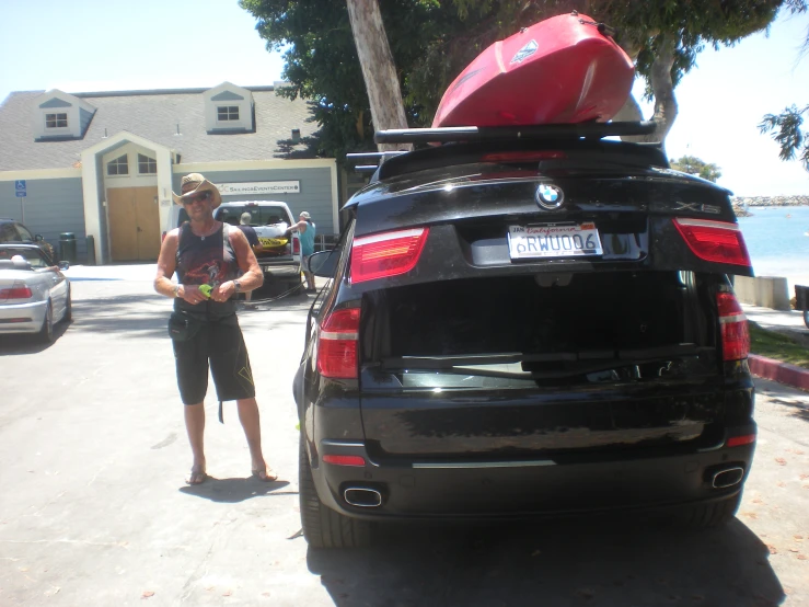 a woman who is standing next to a car