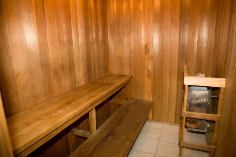 wooden lockers in a building with a bench