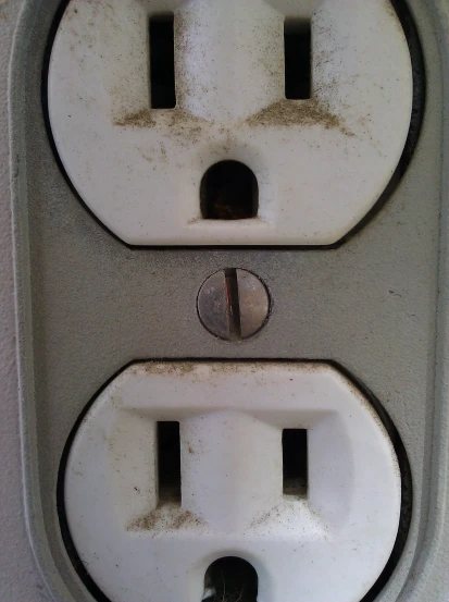 two switches on a wall facing each other