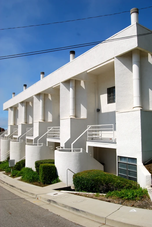 a street view of apartment buildings and the sidewalk