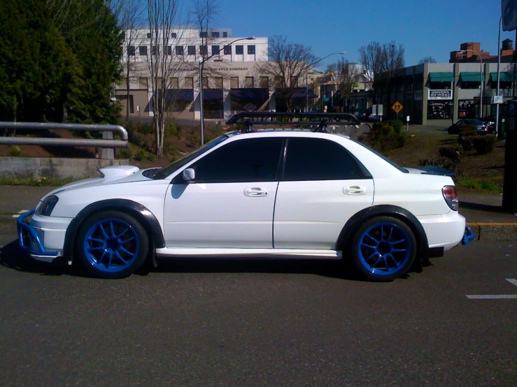 a white car parked in a parking lot