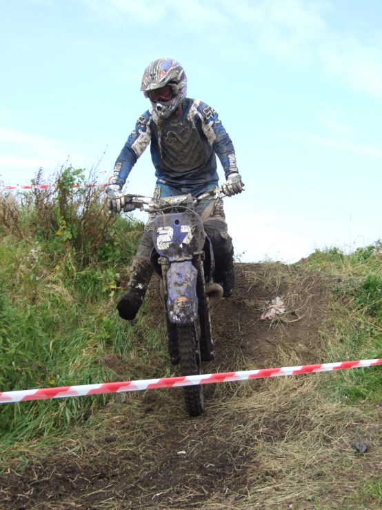 a person riding a motorcycle on a trail