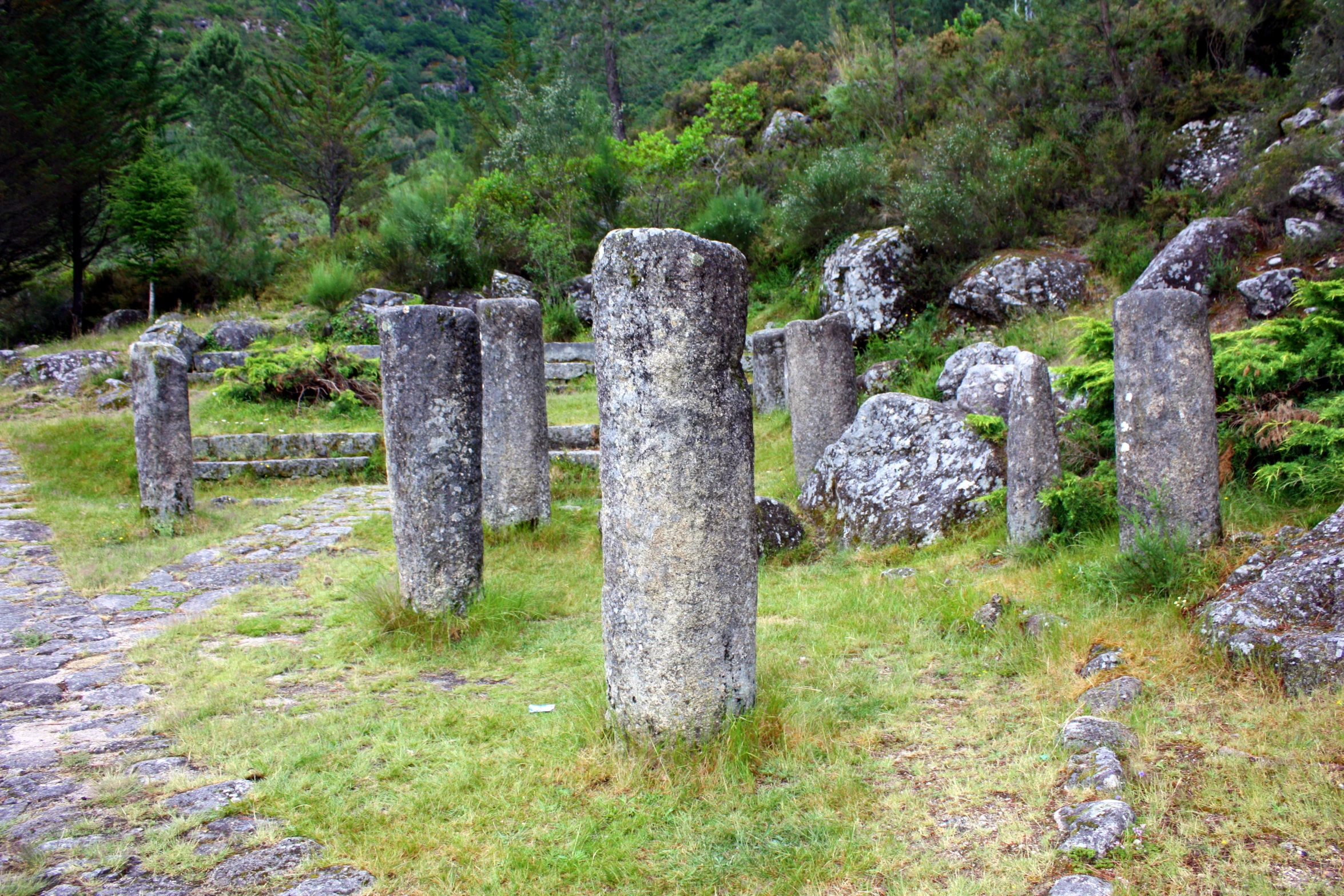 a group of large rocks sitting in the middle of a field