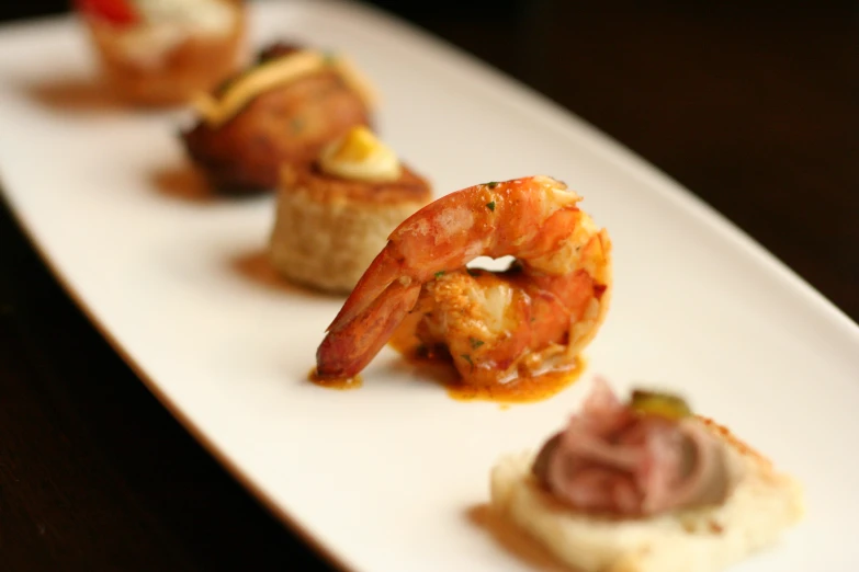 a group of food items sitting on top of a white plate