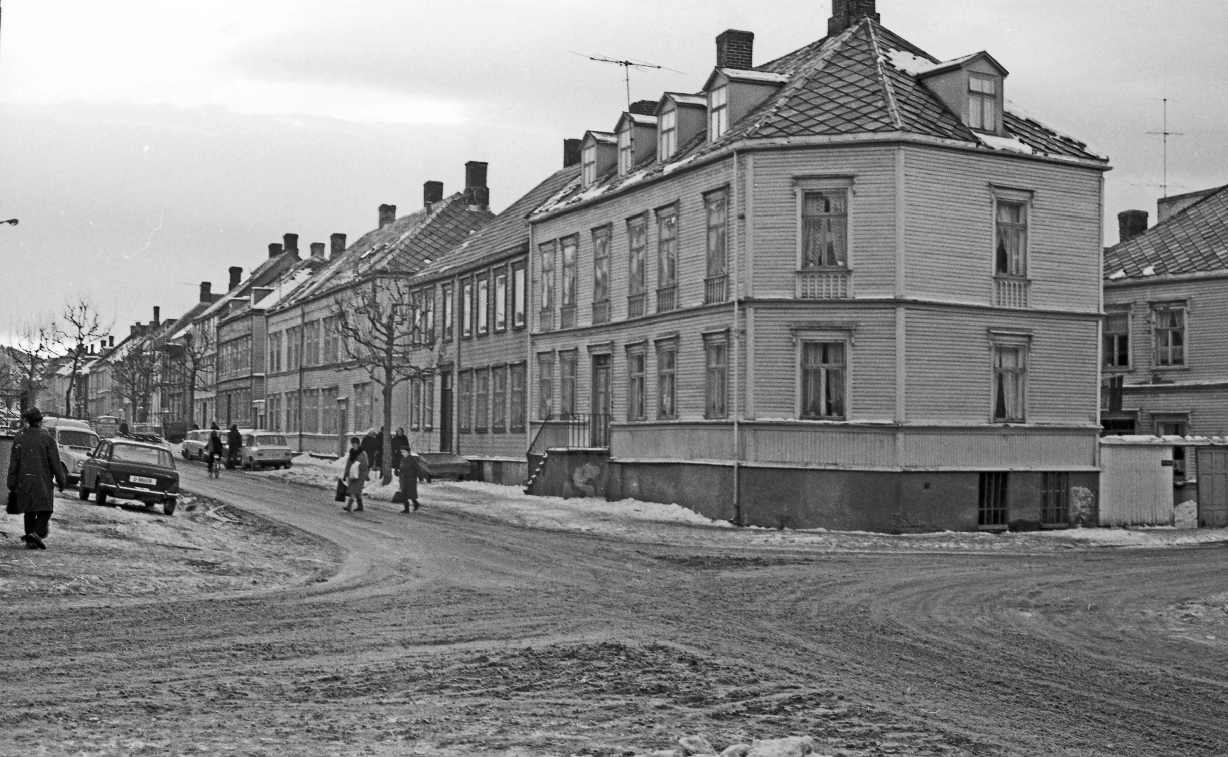 an old town with buildings and people walking