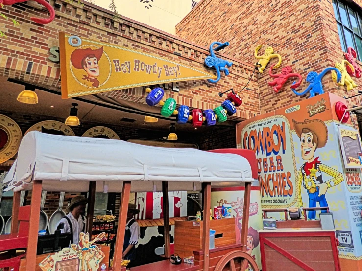 a cart with cartoon decorations hanging from it