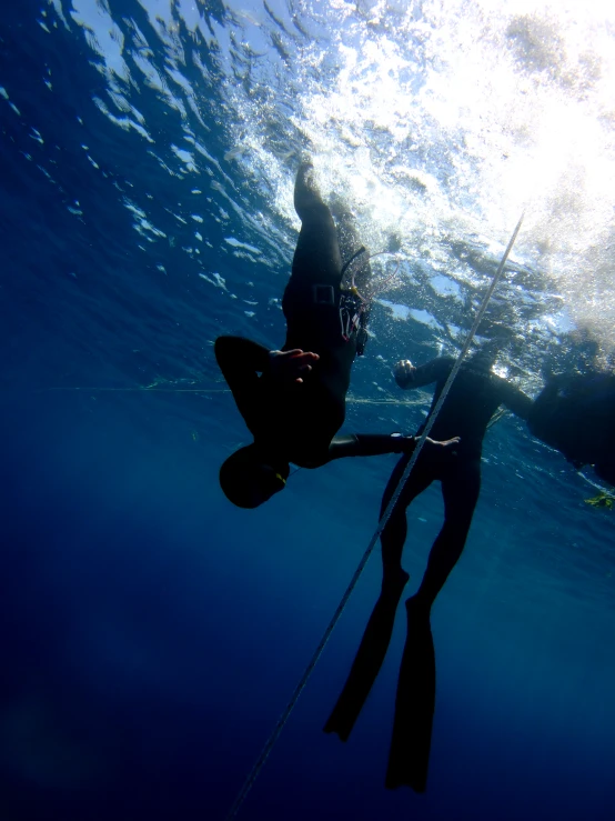 a man riding a board on a body of water