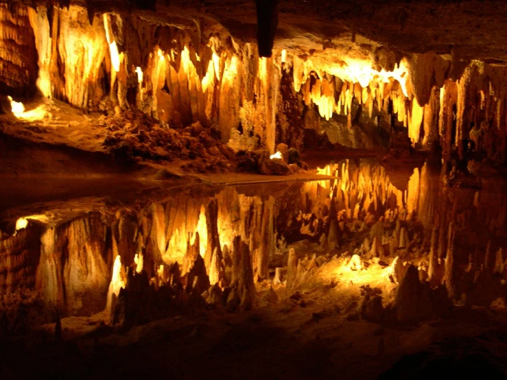 an image of some cave with water and lights