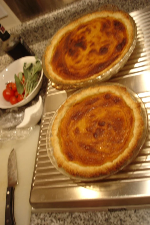 two pies on a counter ready to be baked