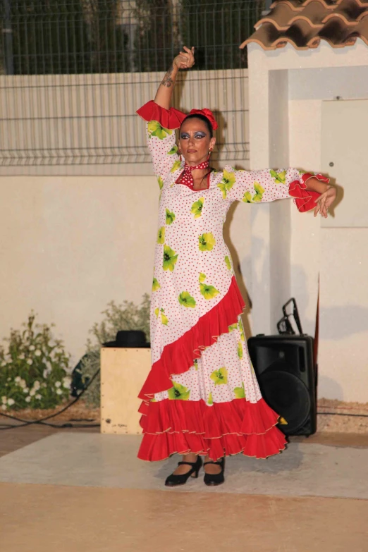 a lady with big black eyes is dancing